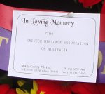 14. The card on CHAA's wreath.